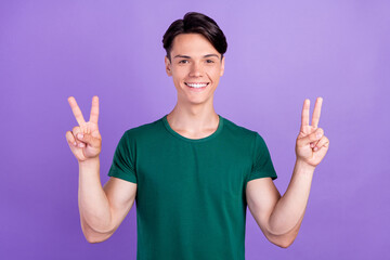 Sticker - Photo of charming young happy positive man show hand v-sign cool isolated on violet color background