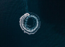 Aerial View Of A Motorboat Sailing On The Sea And Making Splashes