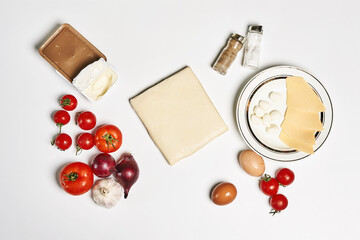 Poster - Top view of pizza ingredients isolated on white background