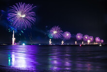 Beautiful Shot Of Purple Fireworks Reflecting From A Lak