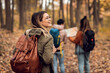 © Zoran Zeremski - Three female friends enjoying hiking in forest.