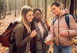© Zoran Zeremski - Three female friends enjoying hiking in forest.