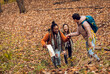 © Zoran Zeremski - Three female friends enjoying hiking in forest.