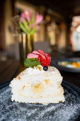 Poster - Closeup shot of a piece of delicious cake decorated with fruits