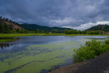 Wall Mural - 2021-06-14 COEUR D'ALENE RIVER WITH A BARN AND CLOUDY SKYS OUTSIDE OF HARRISON IDAHO