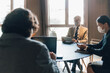 © Image Source RF - Italy, Business people in face masks having meeting in office
