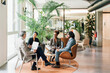 © Image Source RF - Italy, Business people having meeting in creative studio