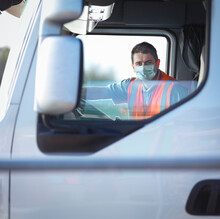 UK, Portrait Of Truck Driver In Face Mask