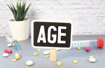 Wall Mural - The word age on wooden cubes. concept