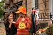 © Pixel-Shot - Cute little children in Halloween costumes outdoors