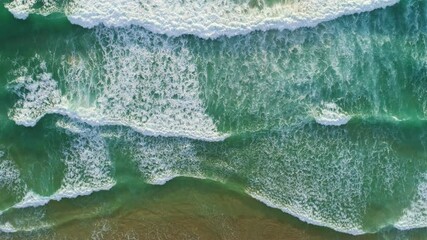 Canvas Print - 4K High quality footage Aerial view of Beautiful wave sea White sea foam in tropical beach sea wave crashing on sandy shore empty and clean beach in sunset or sunrise Beautiful Phuket beach Thailand