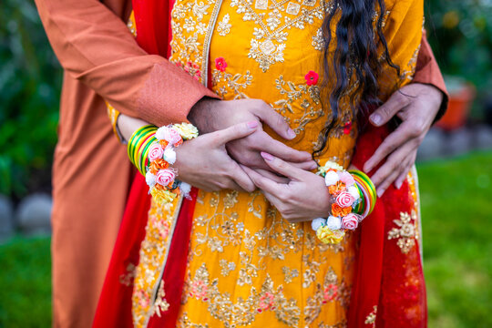 Indian couple's holding hands close up