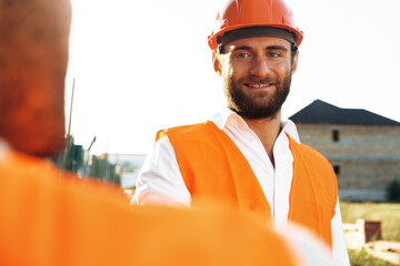 Wall Mural - Portrait of young construction engineer wearing hardhat