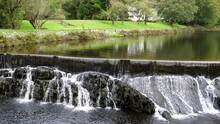 Panning Shot Of Weir And Dam On River Afon Rheidol In North Wales.