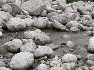 Canvas Print - Closeup shot of pebbles in the river