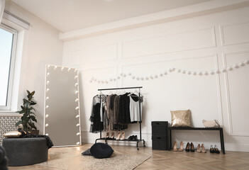 Poster - Stylish dressing room interior with trendy clothes and shoes