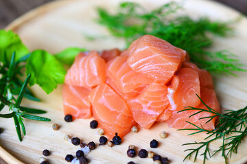 Wall Mural - Fresh salmon fish for cooking salad seafood japanese food, Wasabi sauce raw salmon filet on wooden