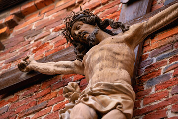 Wall Mural - The crucifixion of Jesus Christ. Antique statue. Horizontal image. Religion concept.