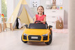 © New Africa - Adorable child driving toy car in room at home