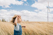 © Cavan Images - Toddler boy in wind farm field