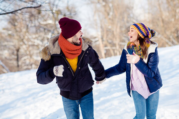 Wall Mural - Photo of attractive young couple happy positive smile go walk run park humor joke laugh have fun enjoy time together