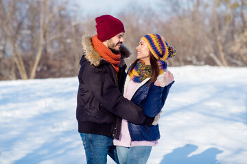 Wall Mural - Profile side photo of young attractive couple happy positive smile hug cuddle embrace walk park romantic