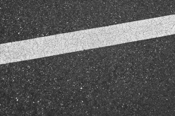 Wall Mural - Surface grunge rough of asphalt, Seamless tarmac dark grey with white line on the road and small rock, Texture Background, Top view