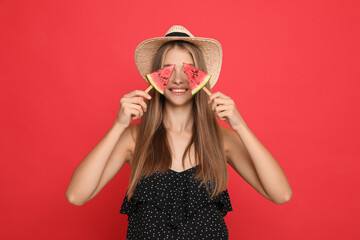 Canvas Print - Beautiful girl with pieces of watermelon on red background