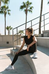 Wall Mural - Sportive woman during her summer workout outdoors