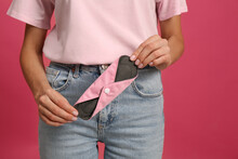 Young Woman With Reusable Menstrual Pad On Bright Pink Background, Closeup