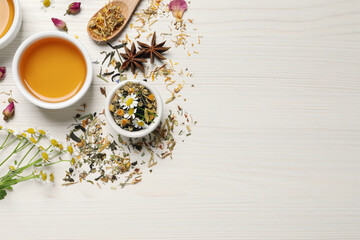 Poster - Flat lay composition with fresh brewed tea and dry leaves on white wooden table, space for text