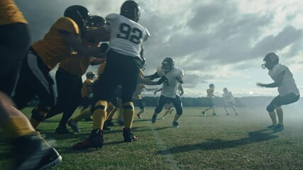 Wall Mural - American Football Field: Two Professional Teams Clash, Trying to Score Touchdown Points. Defense and Offense Brutally Compete for the Ball, Tackle Each other. Dramatic Cinematic Slow Motion Shot