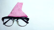 eyeglasses with cleaning cloth flay lay on white background with copy space