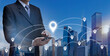 Business man hold smart Phone find location in city by GPS Navigator Map. Businessman in town use GPS internet network on 5G mobile phone show GPS location icon, Business building, travel, 5G concept.