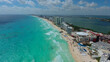 Aerial shot of a beautiful Cancun Mexican city bordering the Caribbean Sea on a sunny day