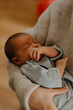 © Ananass - close up portrait of a beautiful sleeping baby in the arms of mom in the bedroom in daylight
