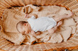 © Ananass - close up portrait of a little child on the bed in her room. Cute baby lies on blanket.