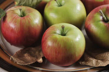 Wall Mural - red ripe apples on a plate - a group of apples