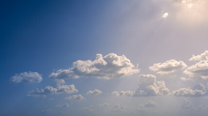 Wall Mural - Wonderful view of cumulus clouds sky with sun light. Daylight yellow sunshine