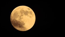 Moving Huge Orange Moon With Craters Against A Black Sky, Natural Sound