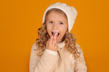 A Blonde Girl In A Knitted Jacket And A Winter Knitted Hat Pours Cold Medicine Into Her Mouth