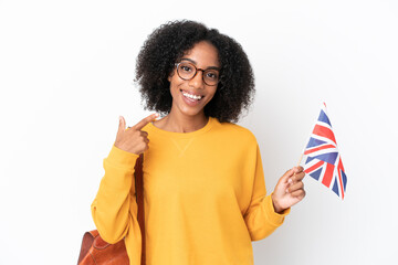 Canvas Print - Young African American woman holding an United Kingdom flag isolated on white background giving a thumbs up gesture