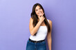 © luismolinero - Teenager Brazilian girl over isolated purple background happy and smiling