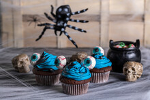 A Halloween Cupcake, Chocolate, Blue And Black Battercream And Gumdrop Eyes. Horizontal Shot And Selective Focus