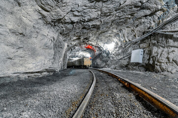 Wall Mural - Underground mine railway for transporting ore. Freight trolleys and wagons