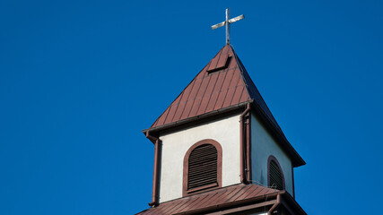 Wall Mural - General view and close-up of architectural details of the Catholic Auxiliary Church of Our Lady of Ostra Brama in Sędki in Masuria in Poland.