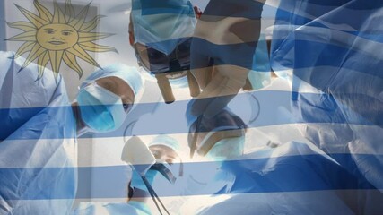 Poster - Animation of flag of uruguay waving over surgeons in operating theatre