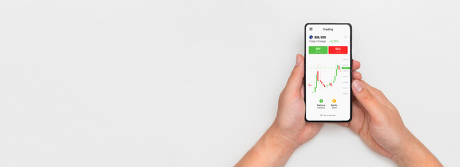 Investor using stock market trading mobile app