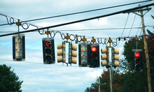 Many Traffic Lights Hanging On Street Crossing