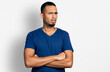 © Krakenimages.com - Young african american man with arms crossed gesture in shock face, looking skeptical and sarcastic, surprised with open mouth